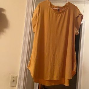 Honey Me Mustard colored short sleeve top with tulip sleeves.  Gently used.